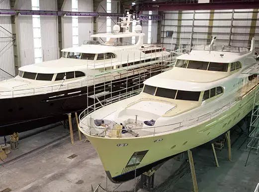 Marine manufacturing facility with two completed boats.